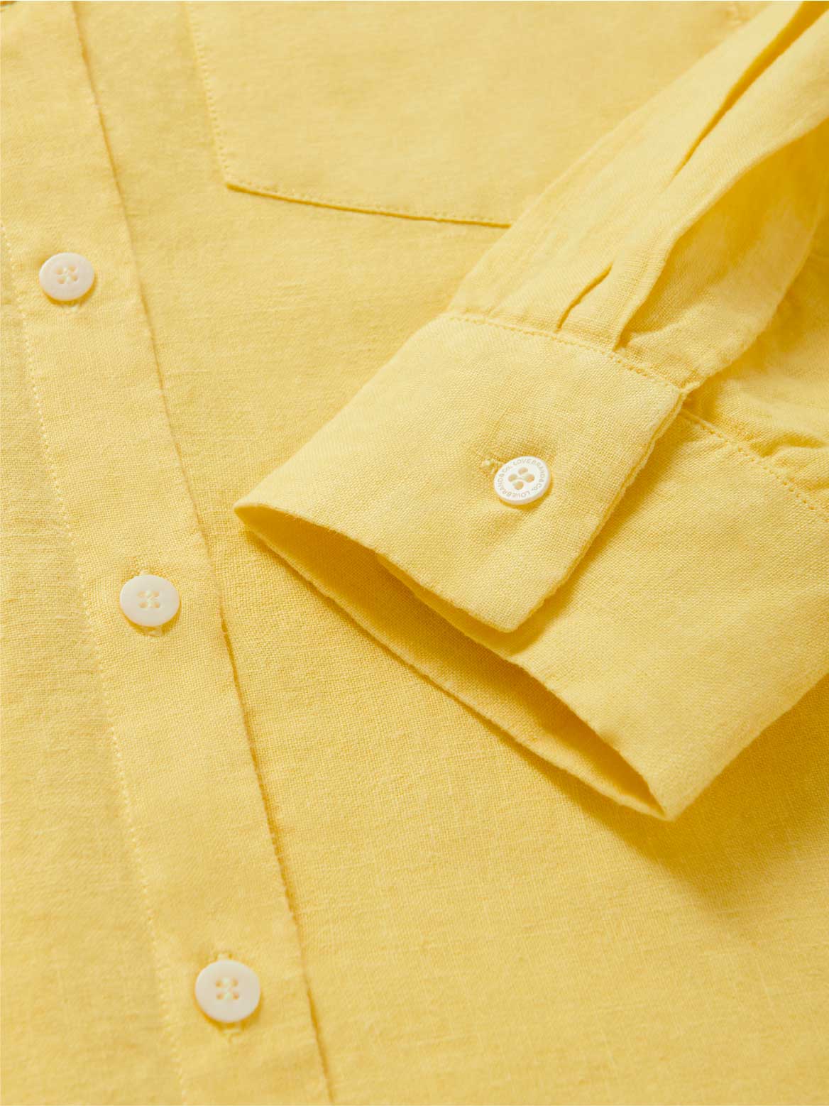 cuff view of yellow linen shirt