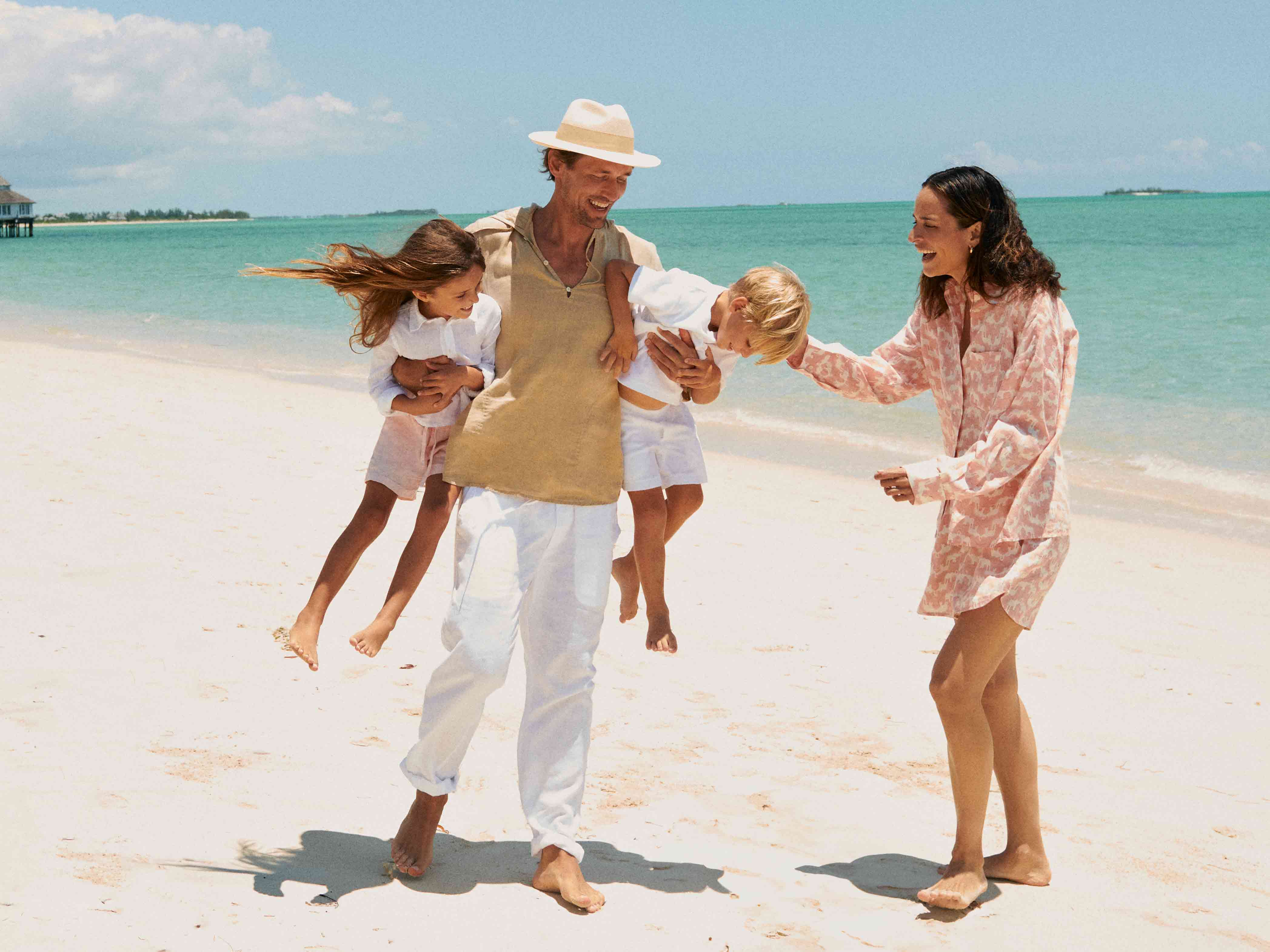 Love Brand & Co. newsletter signup image showing a family on a beach wearing LOVE BRAND & Co. beachwear.