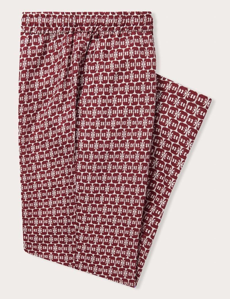 Men's Elephants of India Eleuthera Linen Trousers. Burgundy mens linen pants with white elephant print, featuring a drawstring waist and side pockets.