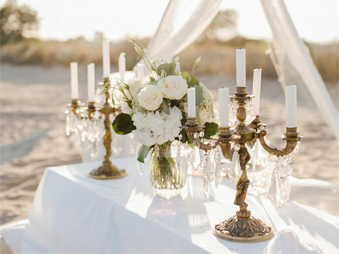 Elegant Candle Holders and White Bouquet in a Vase