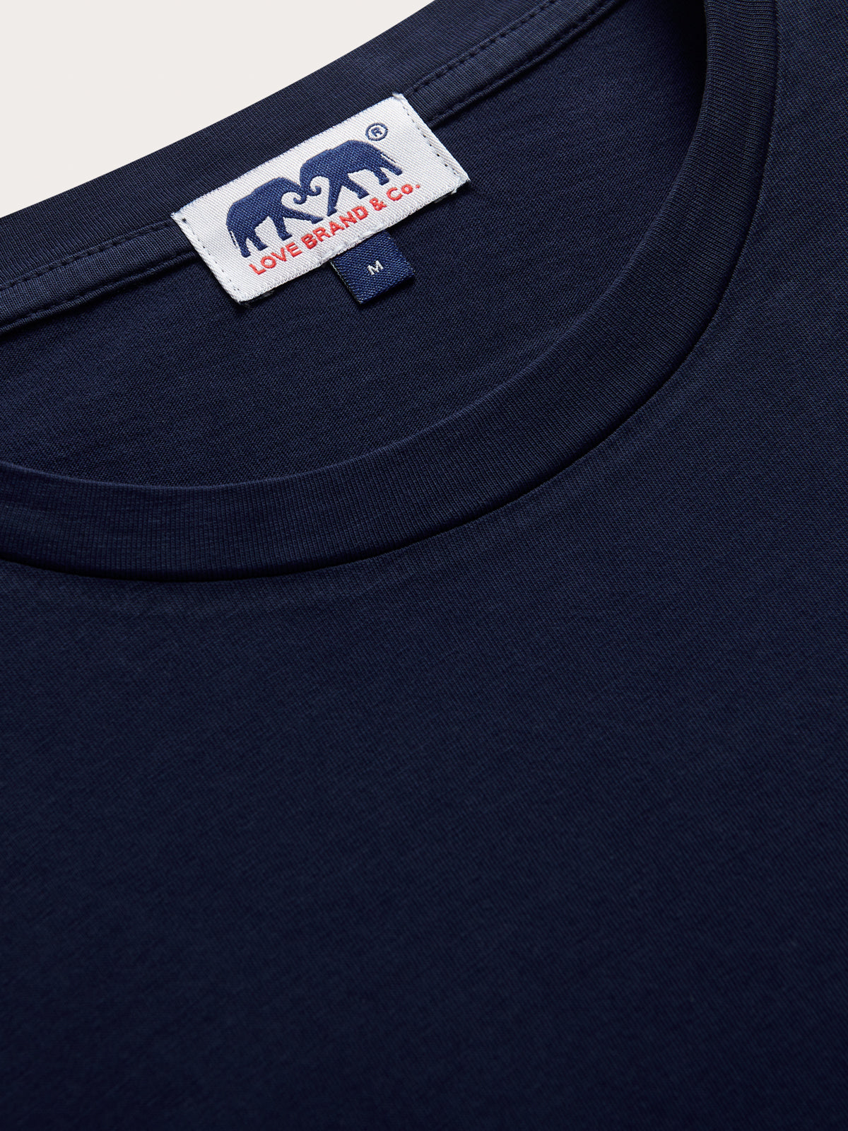 Navy blue t-shirt with a brand label on the collar