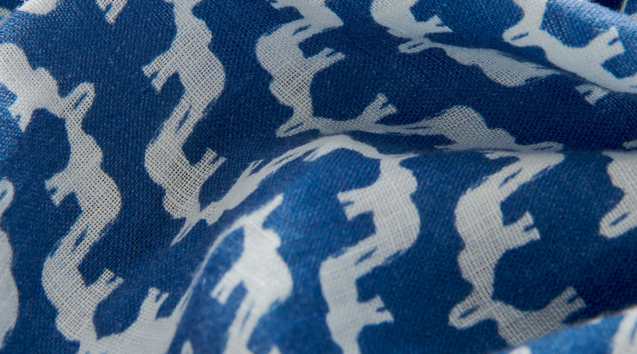 Blue fabric with white elephant pattern