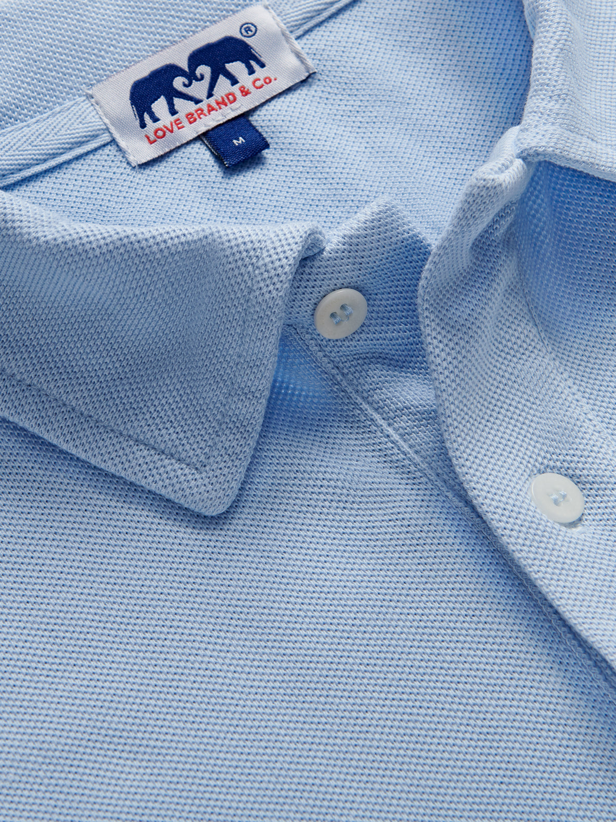 Close-up of mens sky blue polo shirt