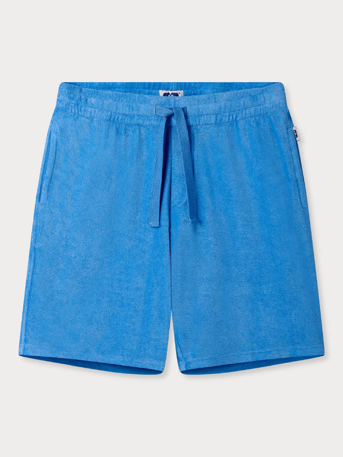 Blue terry towelling shorts with a drawstring waist on a light grey background.