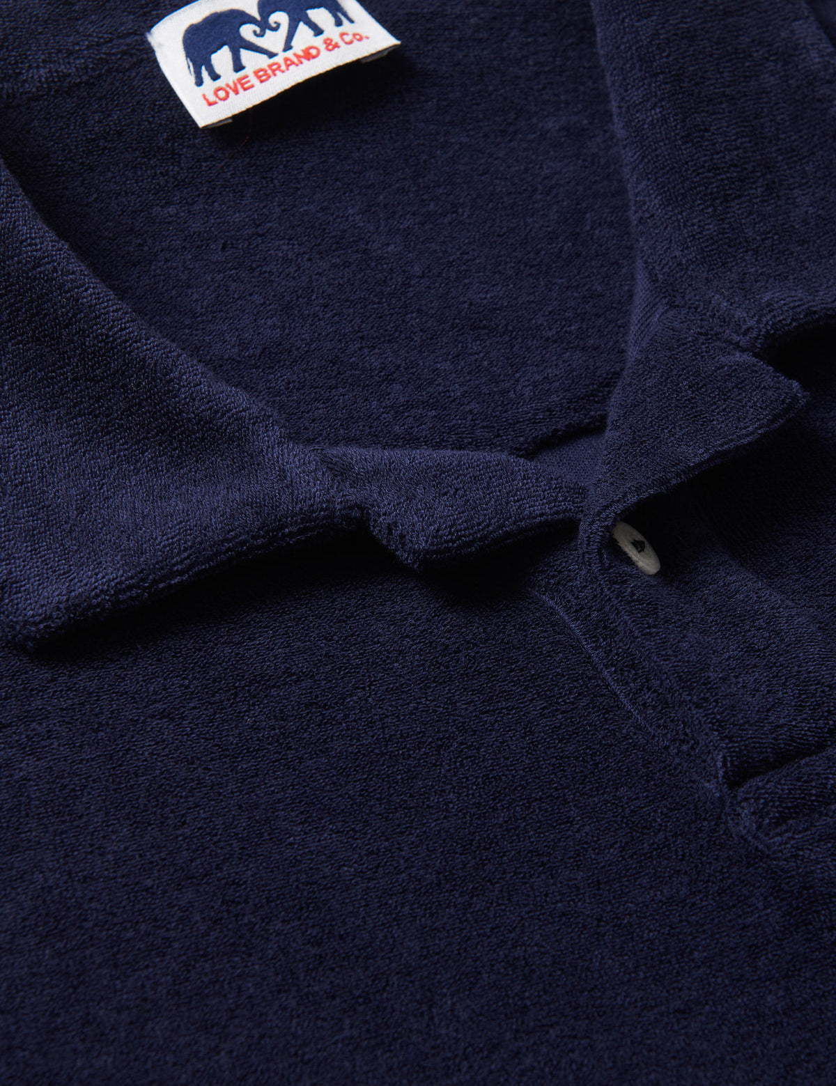 Mens Navy Blue Terry towelling Polo Shirt close-up view. Navy cotton fabric of blue terry polo.