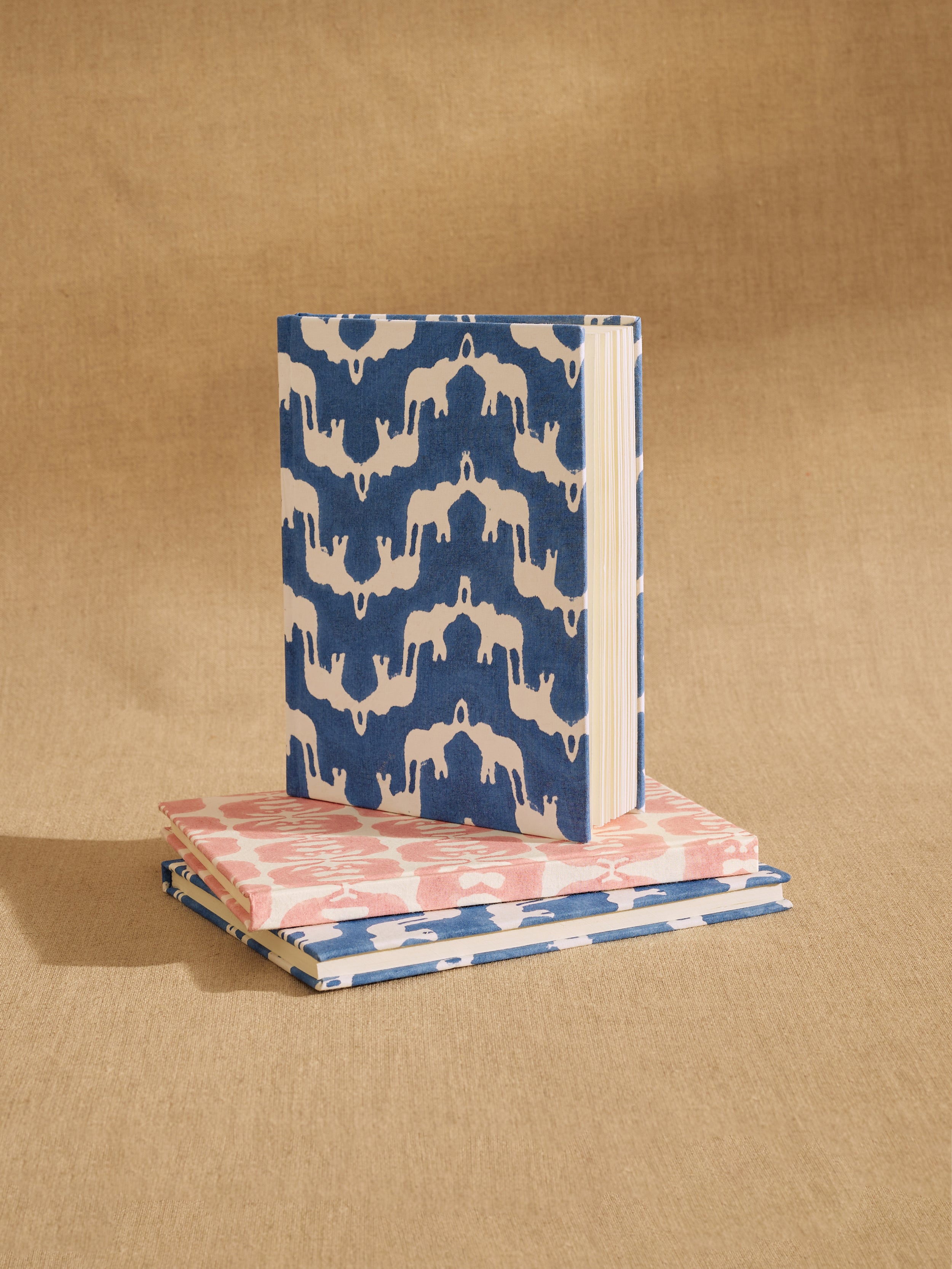 Two notebooks with patterned covers on a brown background for Mother's Day