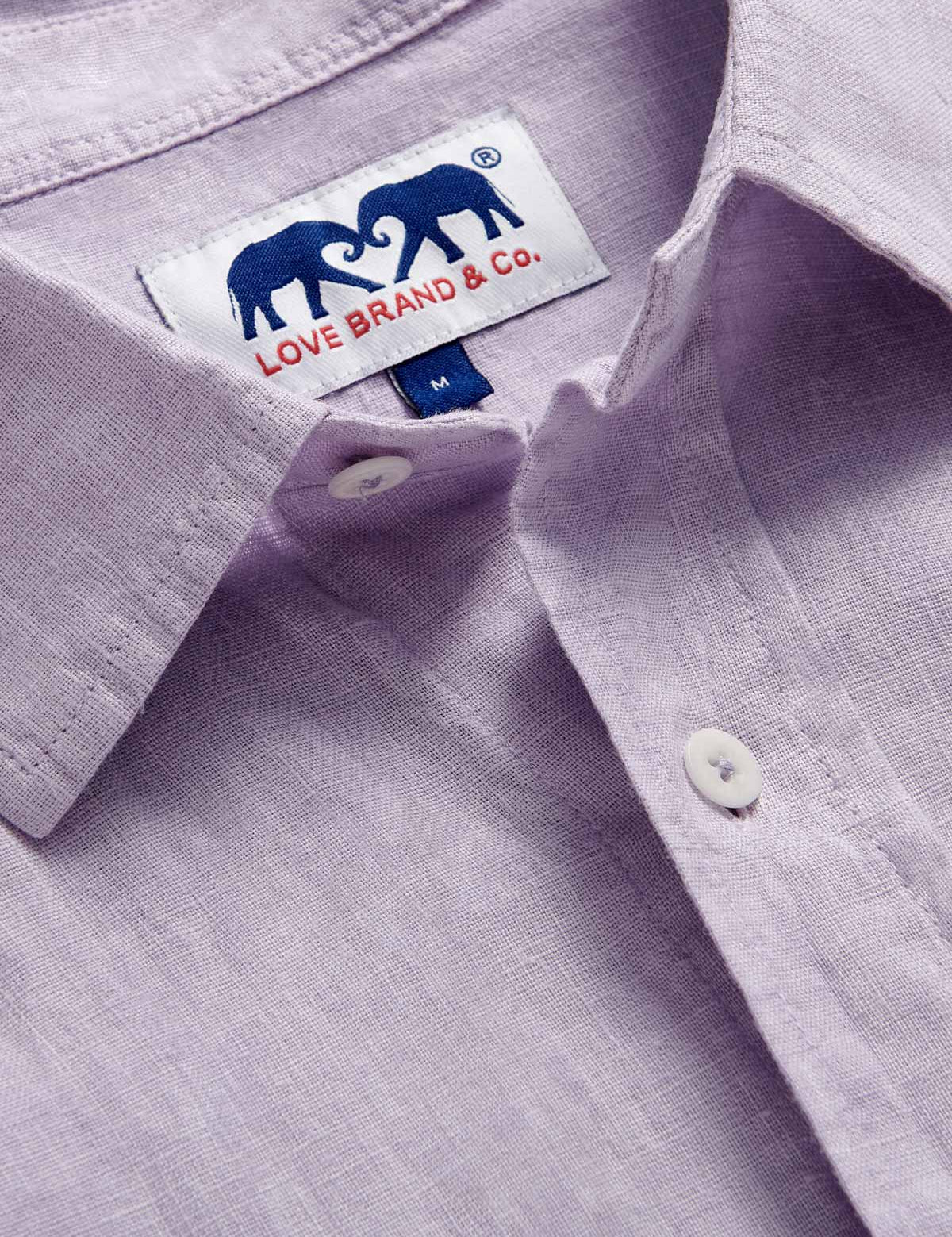 Detailed view of Men's Lilac Abaco Linen Shirt by love brand & co. Pastel purple long-sleeved, button-up 100% linen shirt.