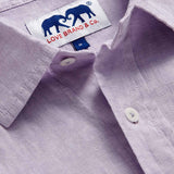 Detailed view of Men's Lilac Abaco Linen Shirt by love brand & co. Pastel purple long-sleeved, button-up 100% linen shirt.