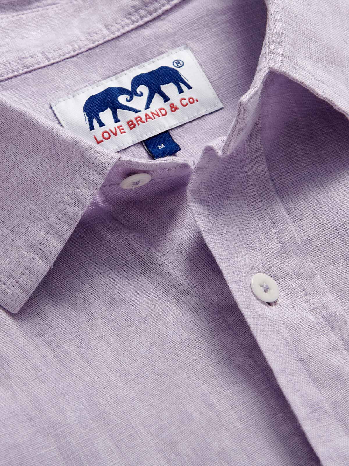 Detailed view of Men's Lilac Abaco Linen Shirt by love brand & co. Pastel purple long-sleeved, button-up 100% linen shirt.