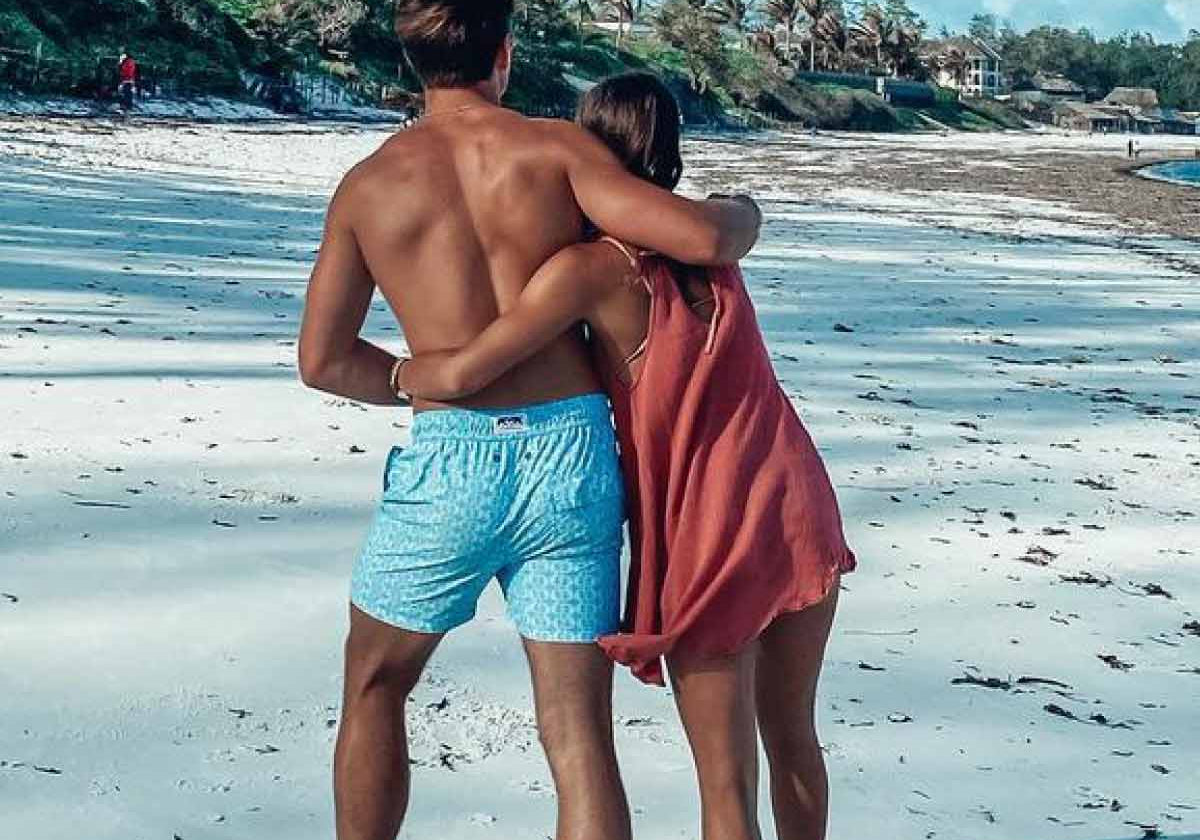 man wears blue swim shorts by resort wear uk brand love brand & co.