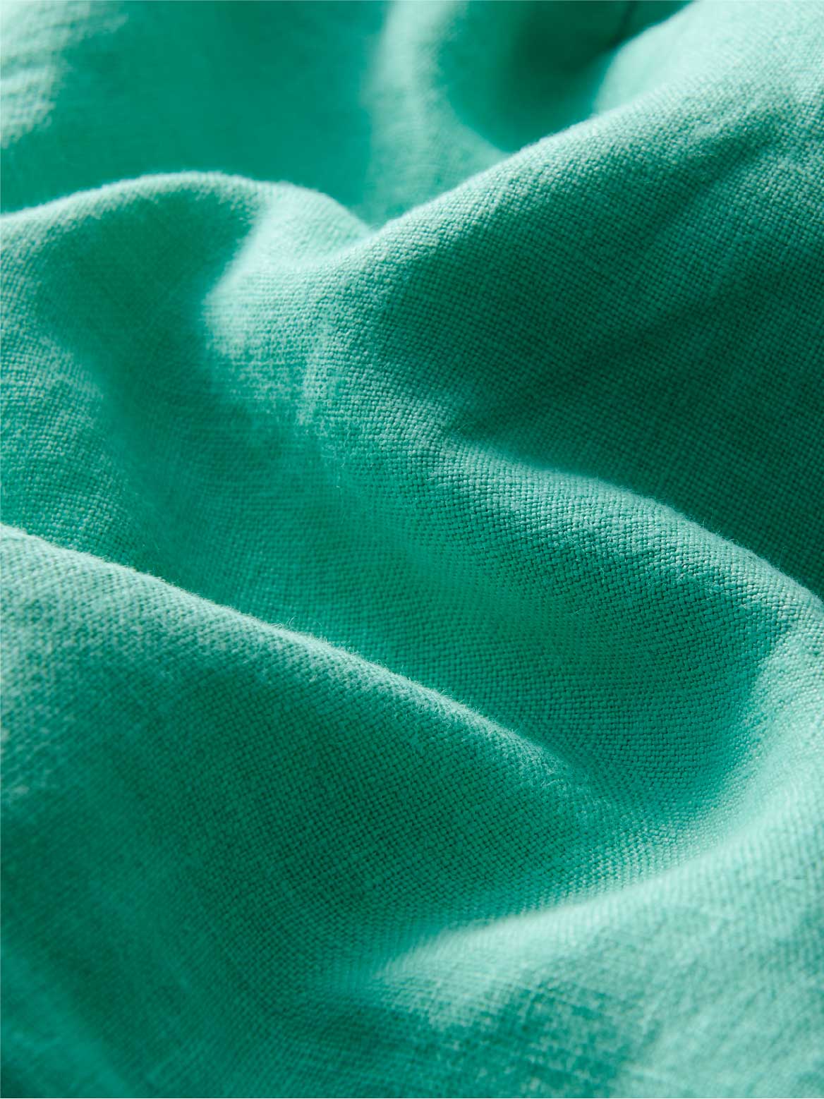 close-up of sea green linen fabric.