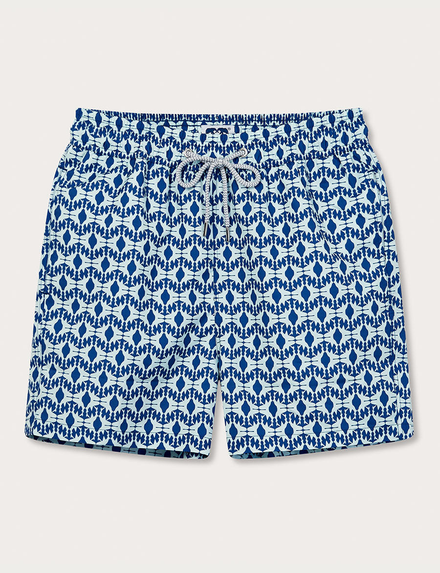 Men's Shark Sanctuary Staniel Swim Shorts in Bahamas blue with silhouette patterns of swimming shark fins, inspired by WildAid and the Bahamas Shark Sanctuary.