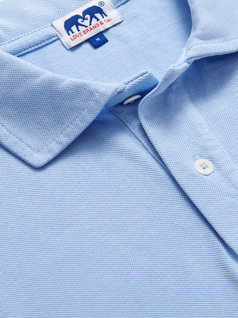 Close-up of Men's Sky Blue Pensacola Polo Shirt displaying the fabric texture and collar detail.