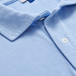 Close-up of Men's Sky Blue Pensacola Polo Shirt displaying the fabric texture and collar detail.