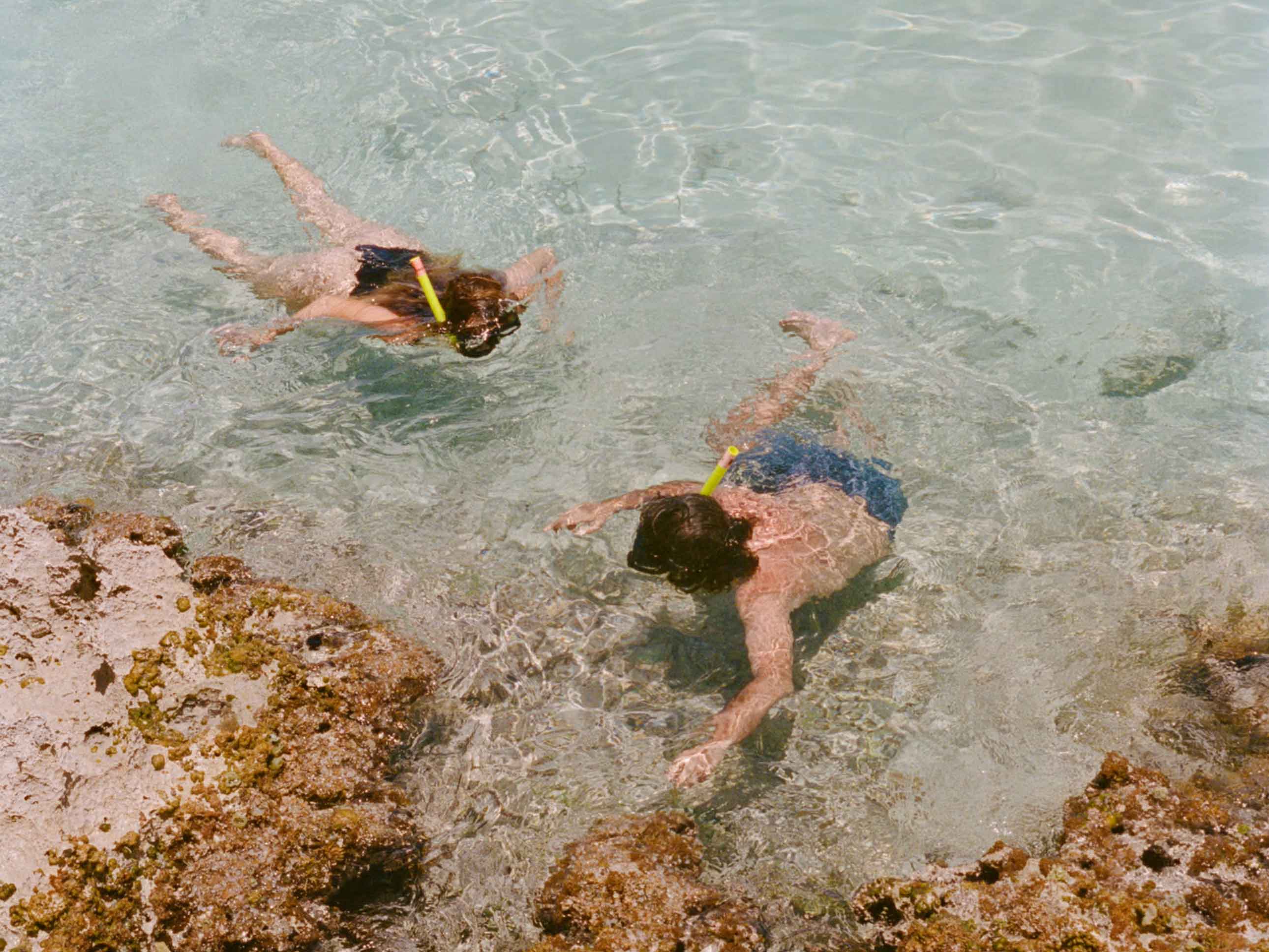 Two people snorkelling in the waters of Cap Juluca