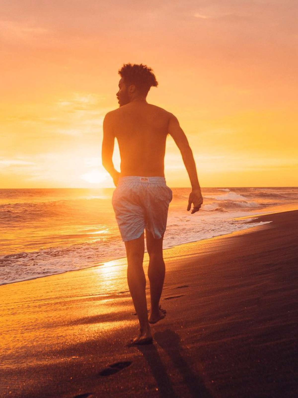 man wears blue mens swim shorts from beachwear brands uk love brand & co.