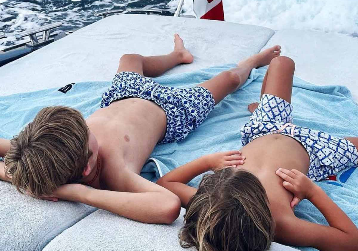 children wear blue and white swim shorts by resort wear uk brand love brand & co.