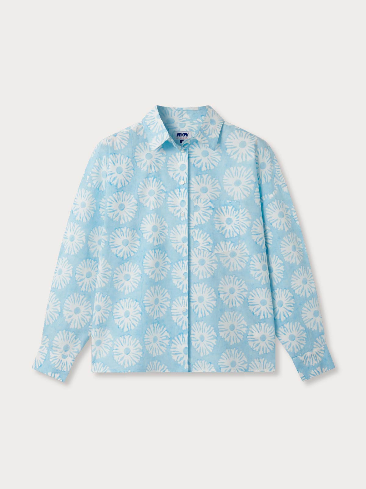 Light blue shirt with white floral pattern on a light grey background.