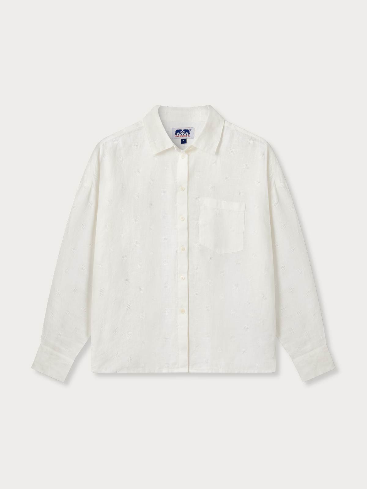 Womens cream shirt with a left breast pocket on a white background.