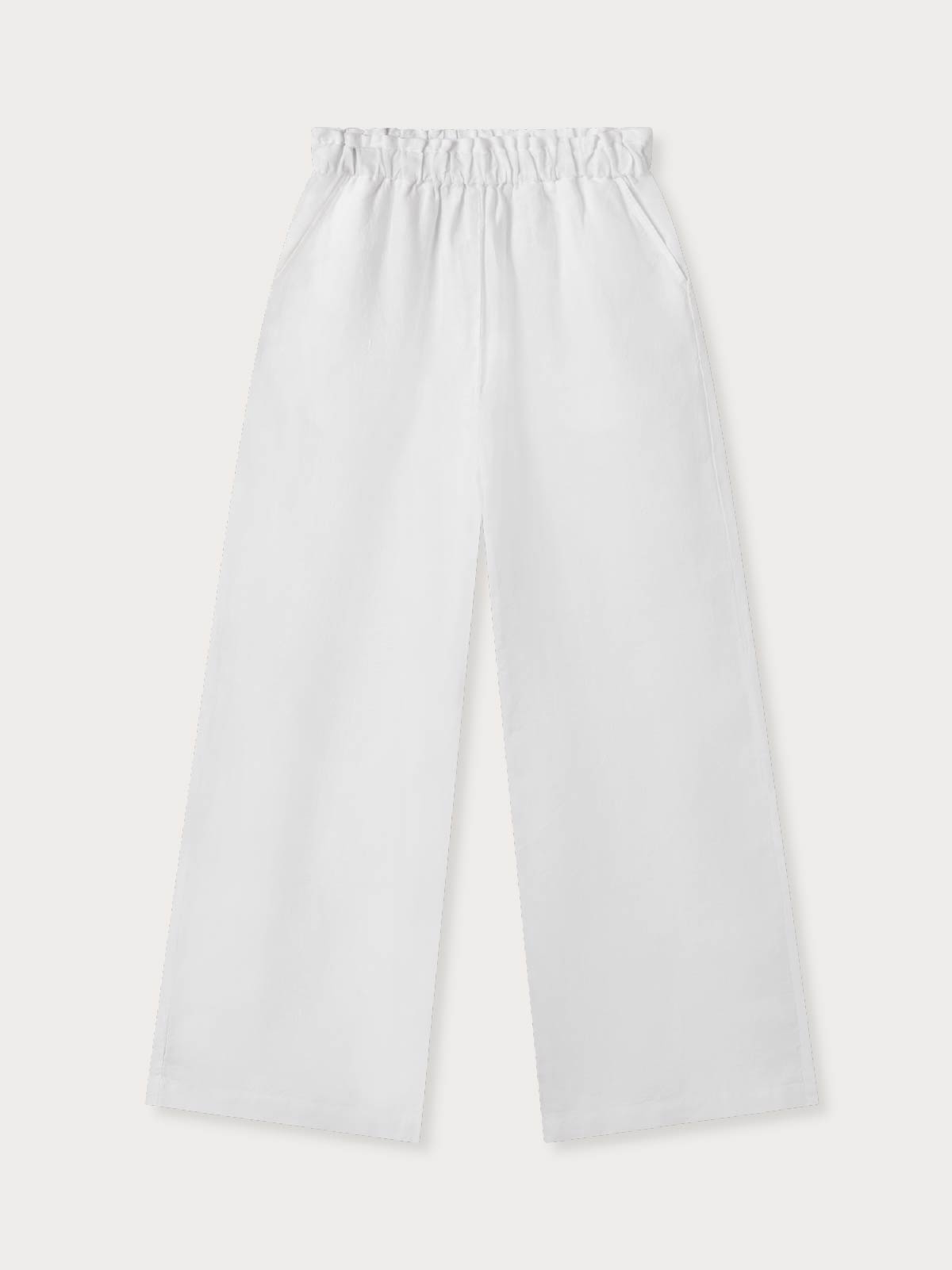 Womens white linen trousers on a white background.