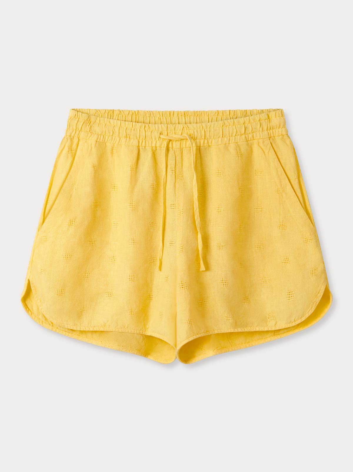 front view of womens yellow shorts showing drawstring waist and side pockets