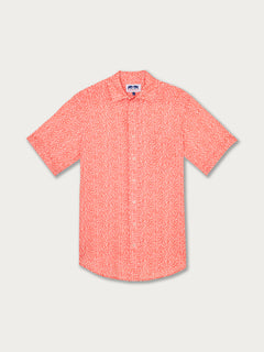 Men's Code Ray Manjack Linen Shirt in coral, featuring intricate designs inspired by Staniel Cay Spotted Eagle Rays. Men's linen shirt in coral red fabric.