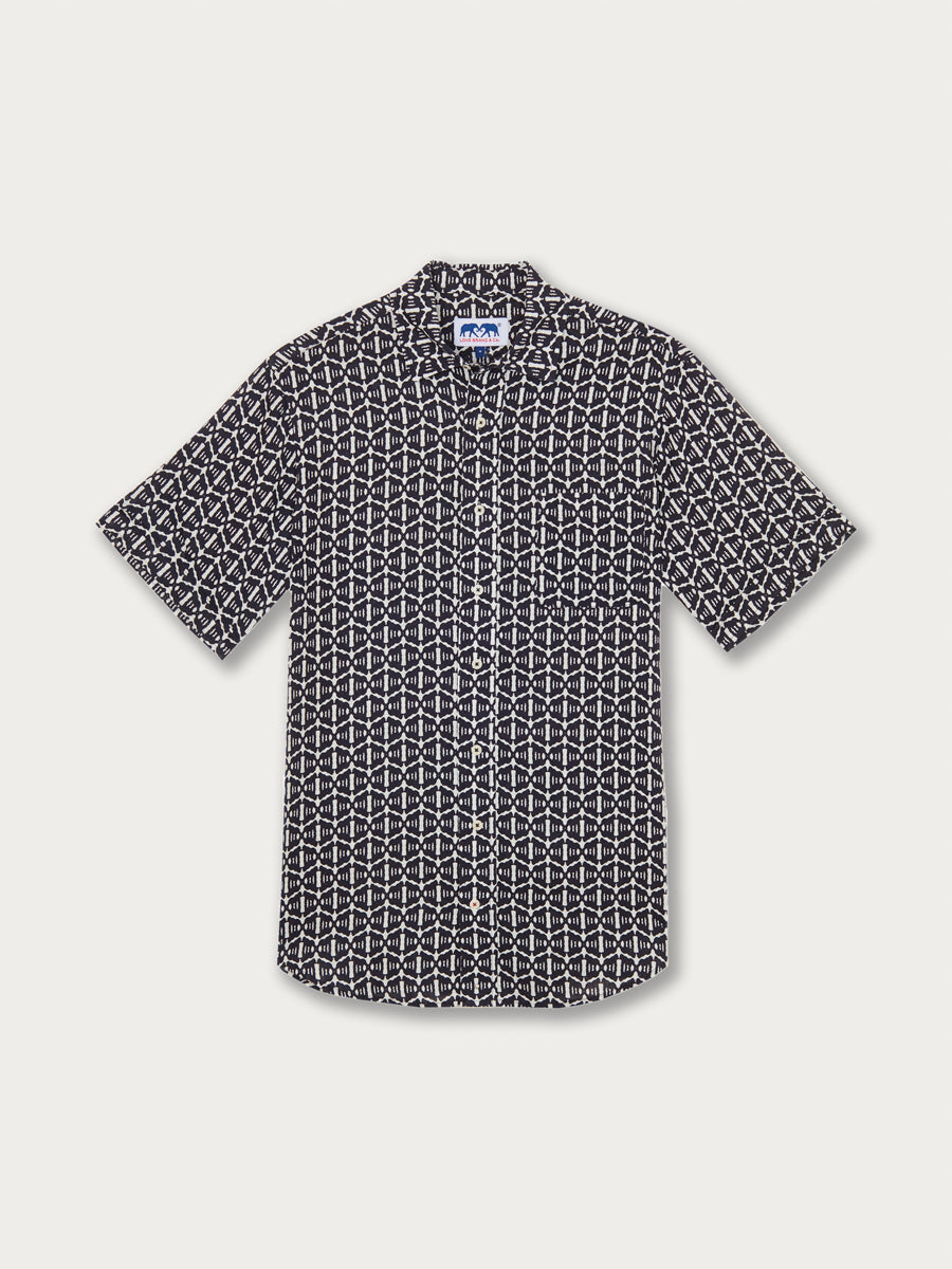 Men's Gorilla Gossip Manjack Linen Shirt with geometric navy and white print. This men's linen shirt honours the Aspinall Foundation for western lowland gorilla protection.