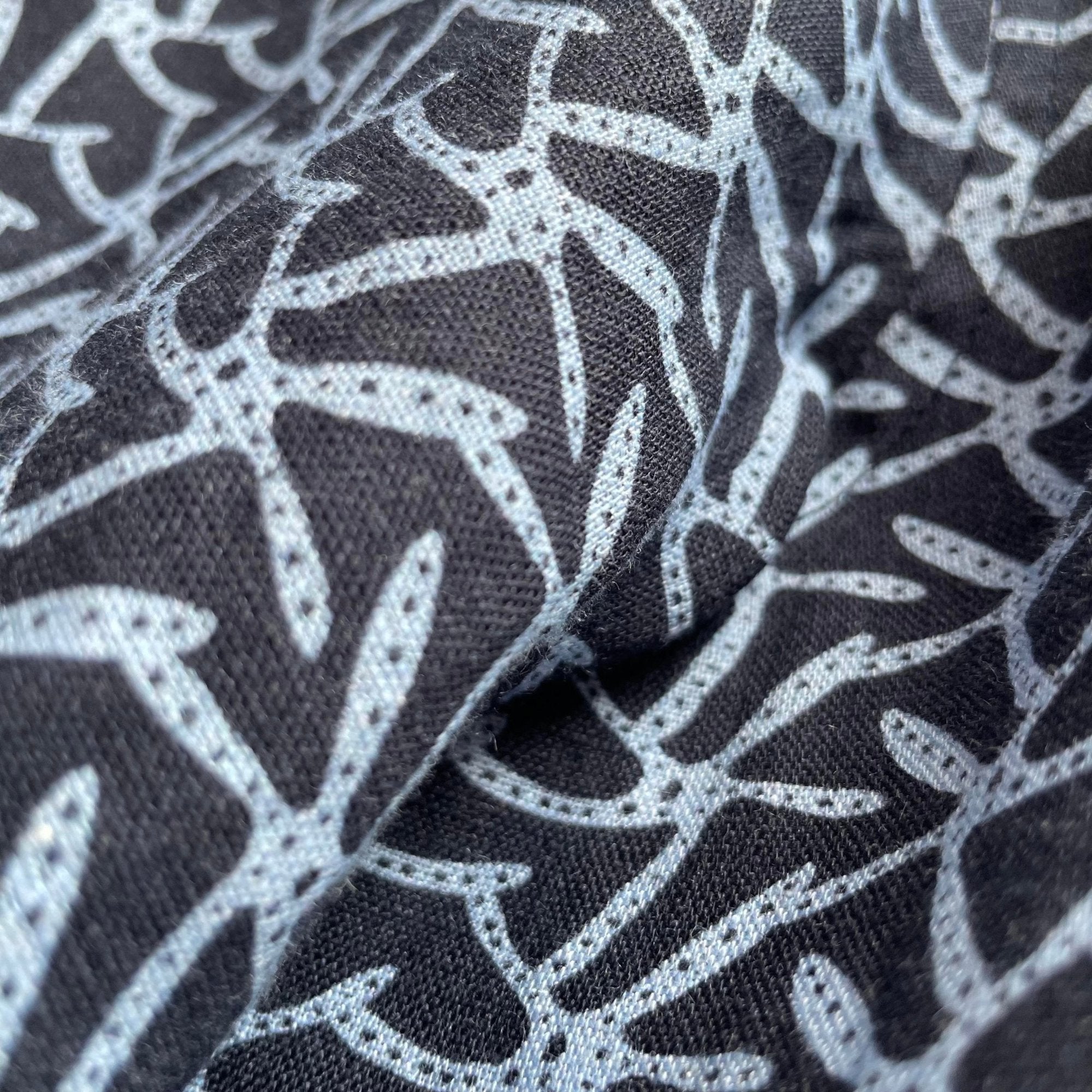 Close-up view of the starfish pattern on the Men's Star Gazing Manjack Navy Blue Linen Shirt.