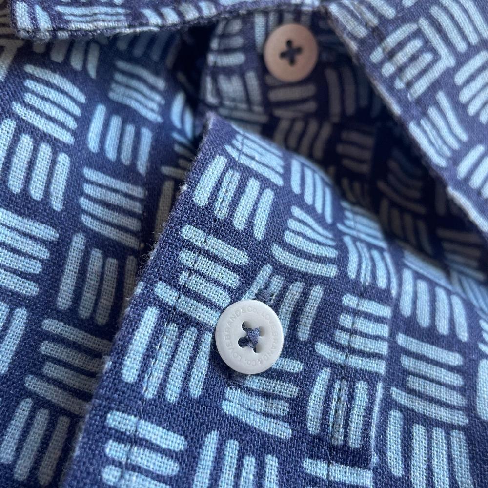 Close-up view of the Men's Sea Weave Abaco Linen Shirt, exclusively designed for Nobu Hotel Ibiza Bay, featuring a unique pattern inspired by the Posidonia seagrass meadows in Ibiza.