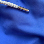 Close-up of Boys Majorelle Blue Staniel Swim Shorts fabric with drawstring detail.