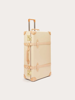 Globe-Trotter Safari 30" Trolley Case in cream color with leather straps and gold-tone hardware.