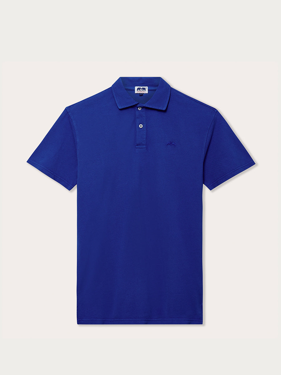 Men's Majorelle Blue Pensacola Polo Shirt made from 100% organic cotton, displayed against a light neutral background.