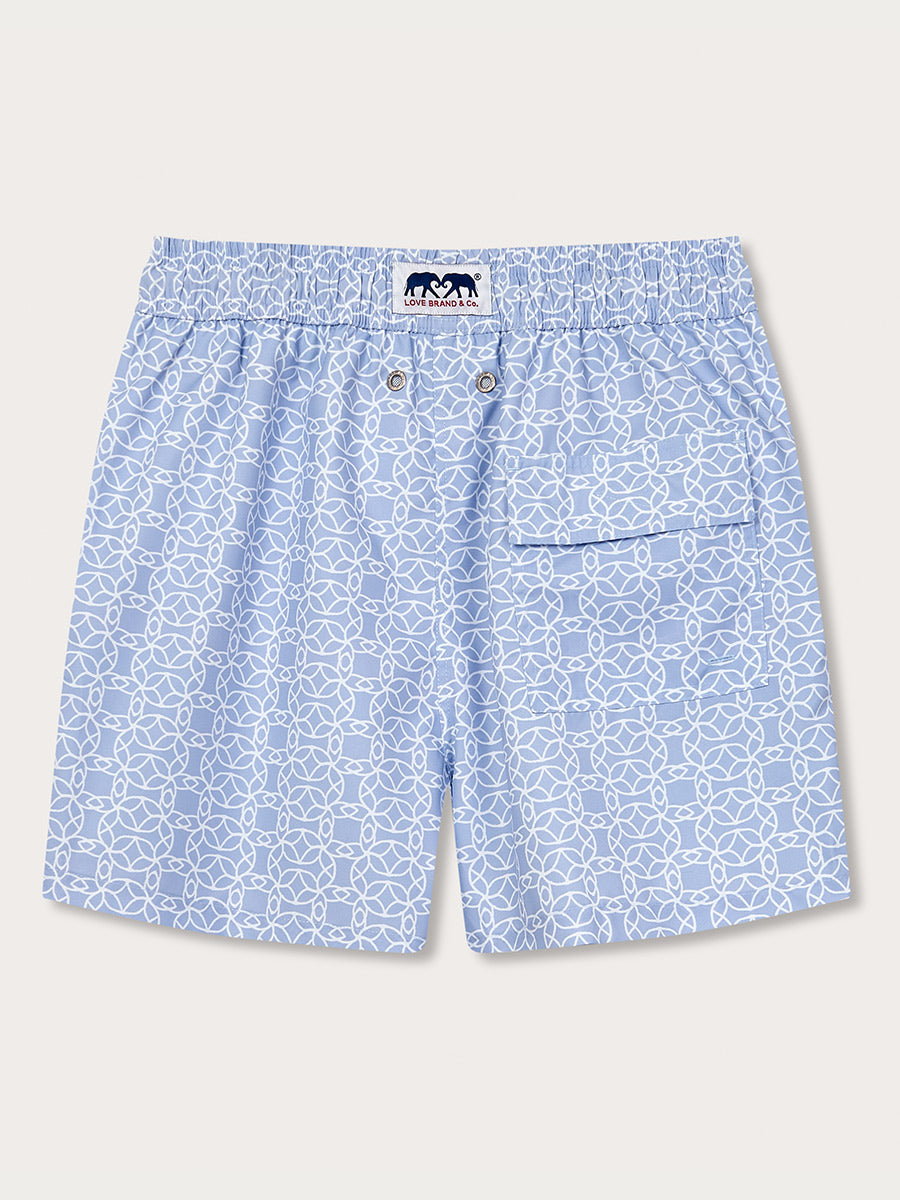 Men's Regeneration Staniel Swim Shorts with light blue Frangipani flower pattern. Crafted from 100% recycled plastic, inspired by the regeneration of ecosystems post-Hurricane Irma.