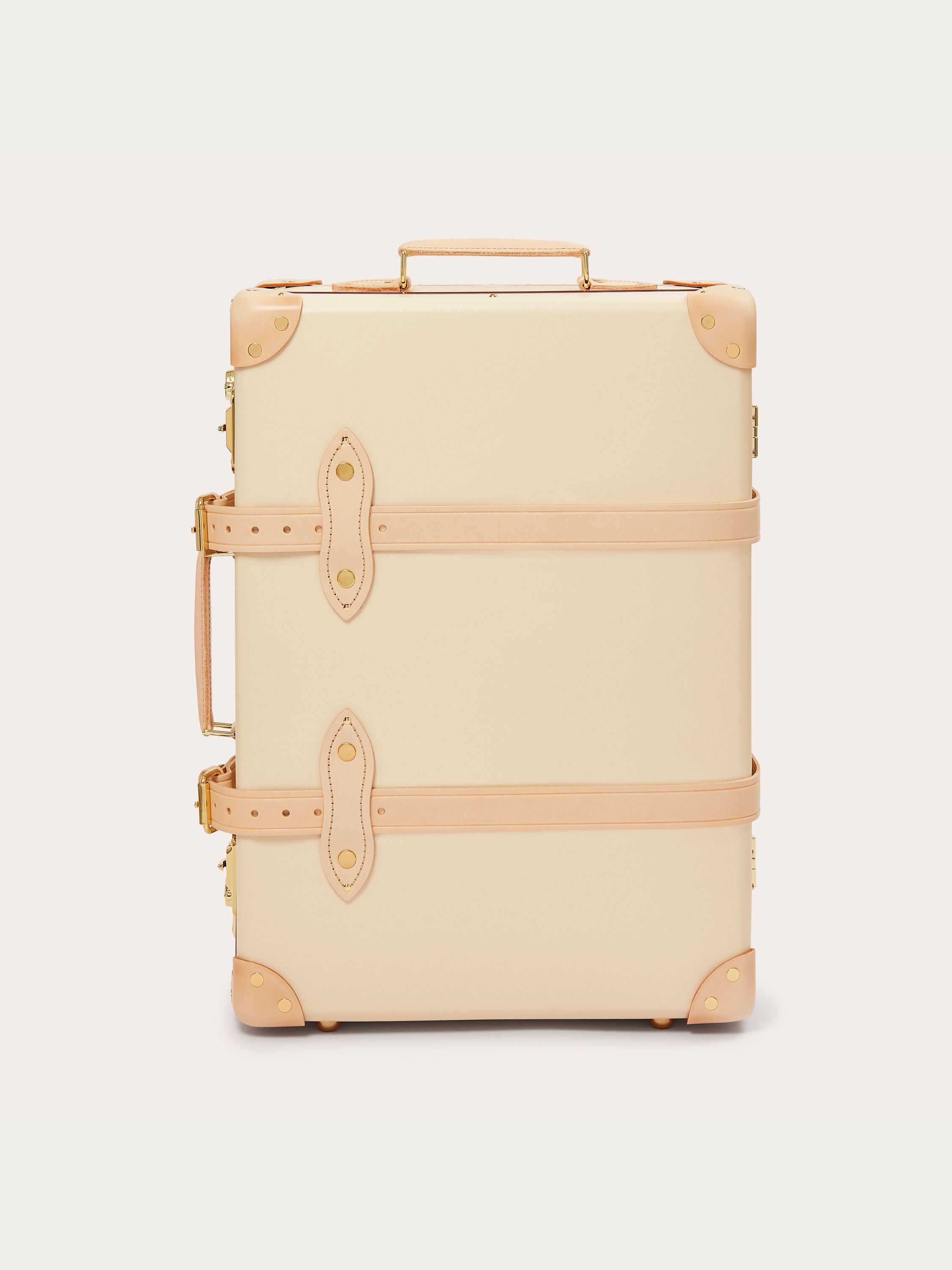 Globe-Trotter Safari 20" Trolley Case in cream with tan leather straps and corners. Trolley case featuring a durable handle on top and side for easy carrying.