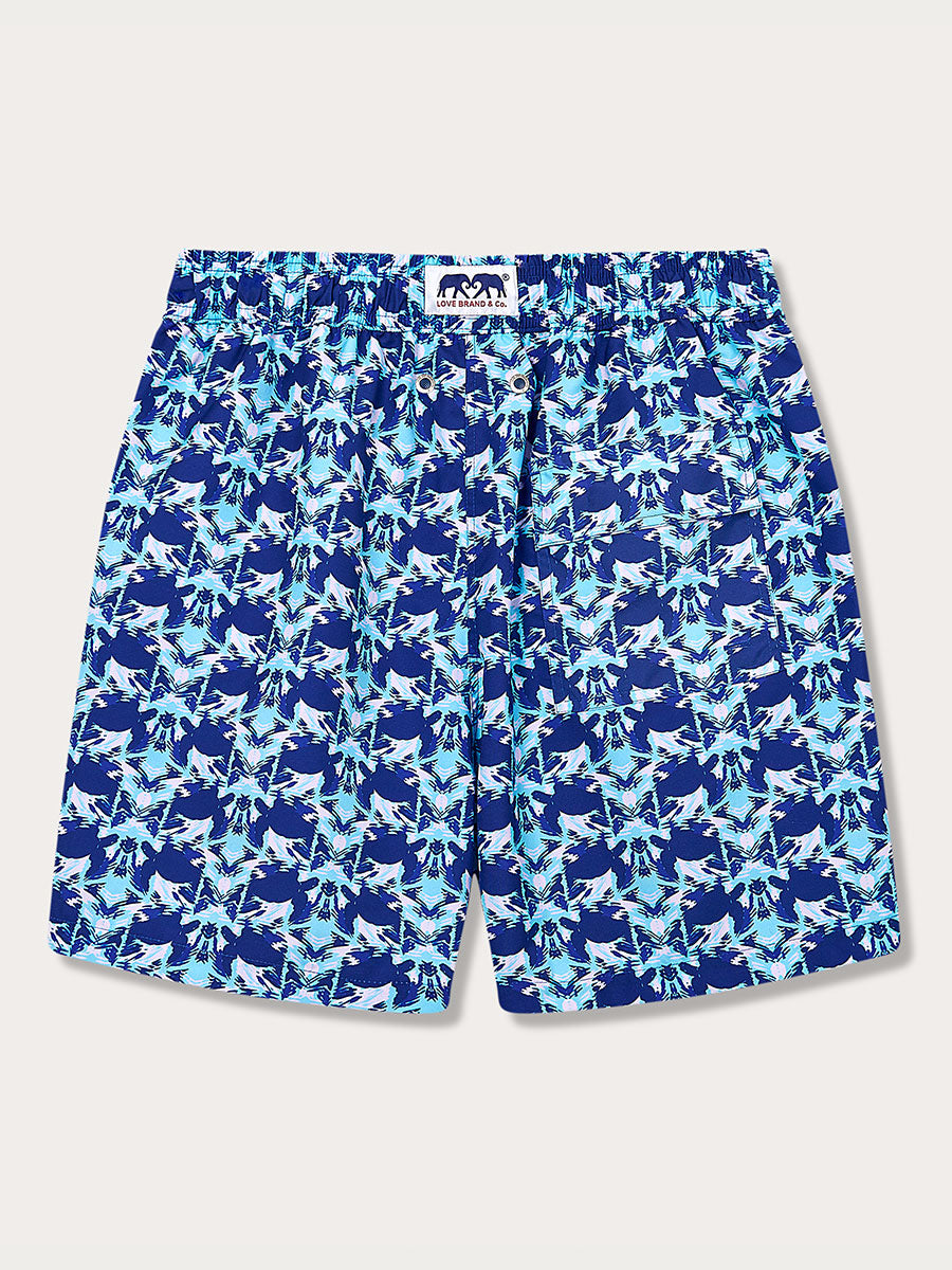 Men's Turtle Eclipse Staniel Swim Shorts in blue and lavender shades with turtle and seaweed motifs, featuring a signature branding label.