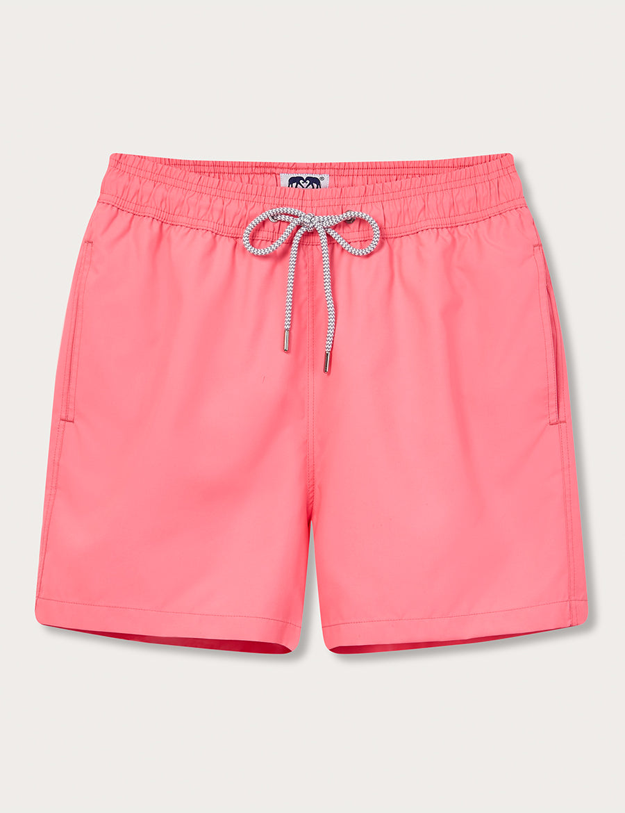 Men's bright pink-red swim shorts with elastic waistband and drawstring, titled "Watermelon Staniel Swim Shorts"